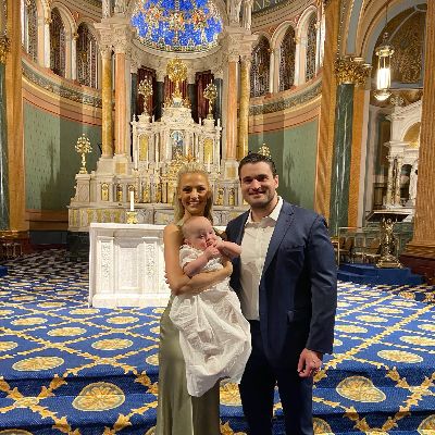 Carley Shimkus and her husband, Peter Buchignani, took a picture with their son, Brock Buchignani, when he was baptized.
